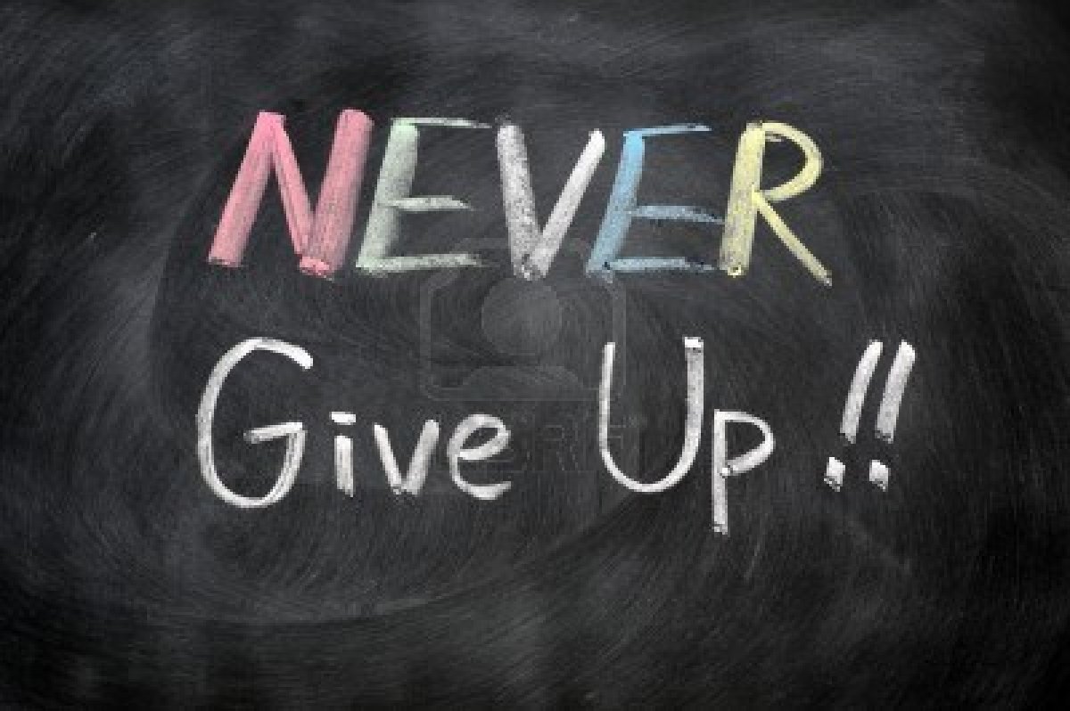 11939322-never-give-up-written-in-chalk-on-a-blackboard.jpg